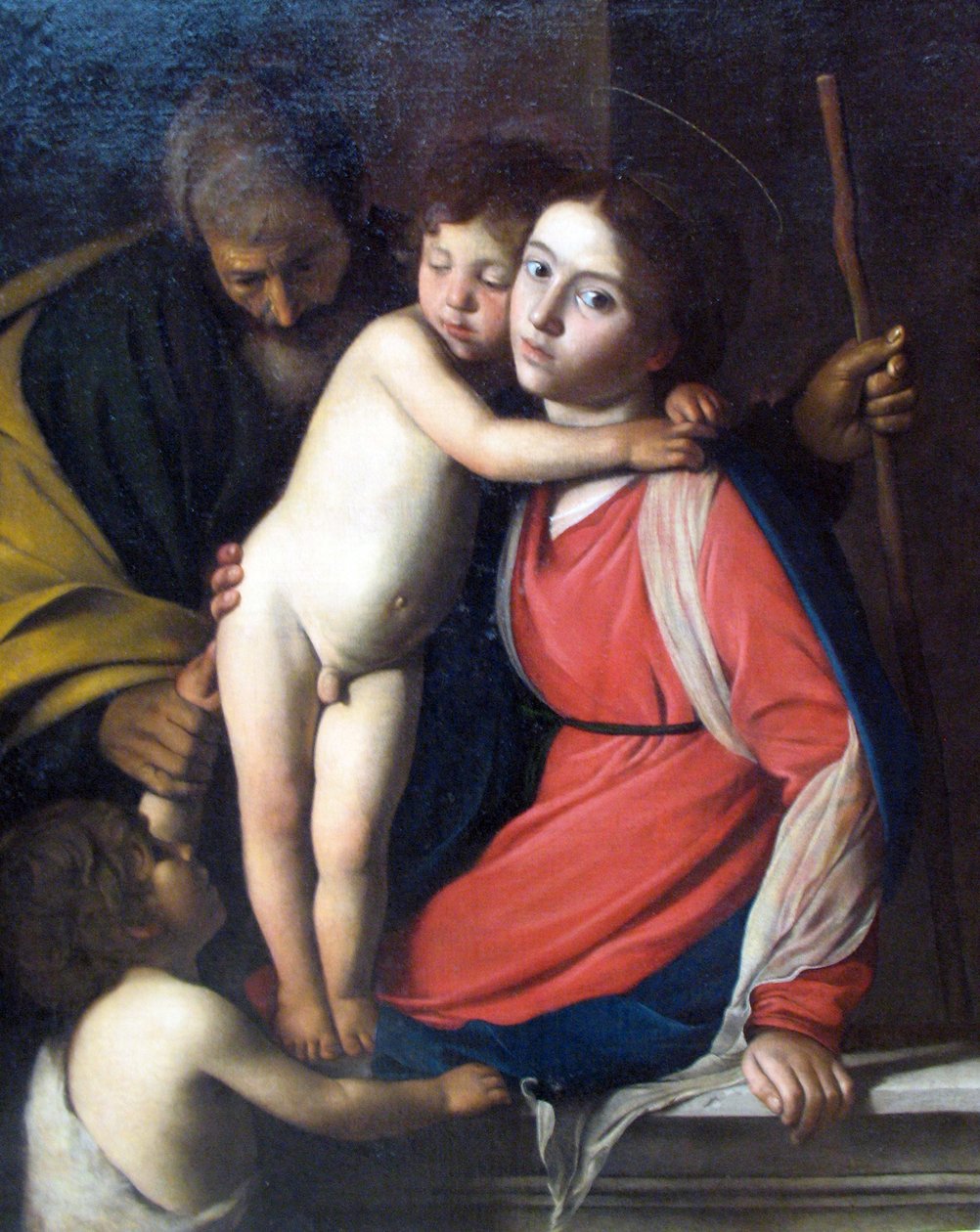 Pyhä perhe vauvan kanssa Johannes Kastaja tekijältä Michelangelo Merisi Caravaggio