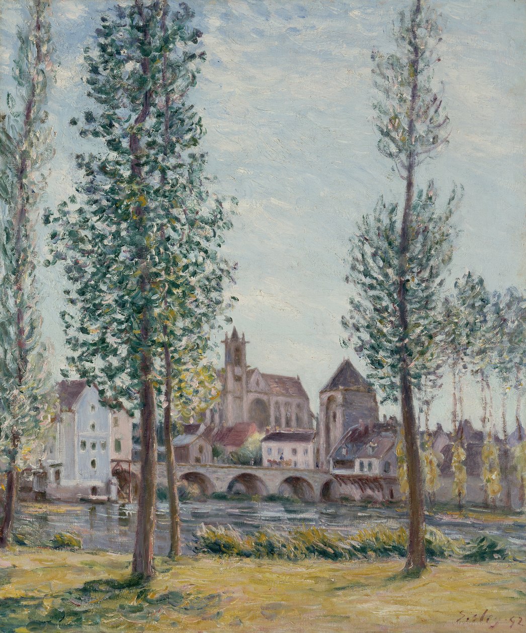 Näkymä Moret sur Loingiin puiden läpi tekijältä Alfred Sisley