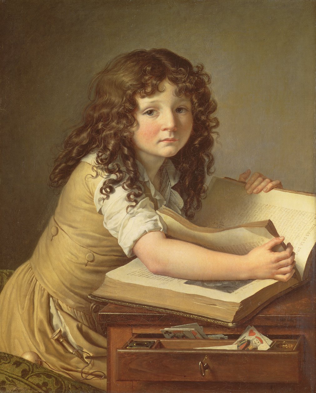 Lapsi katselee kirjan kuvia tekijältä Anne Louis Girodet de Roucy Trioson