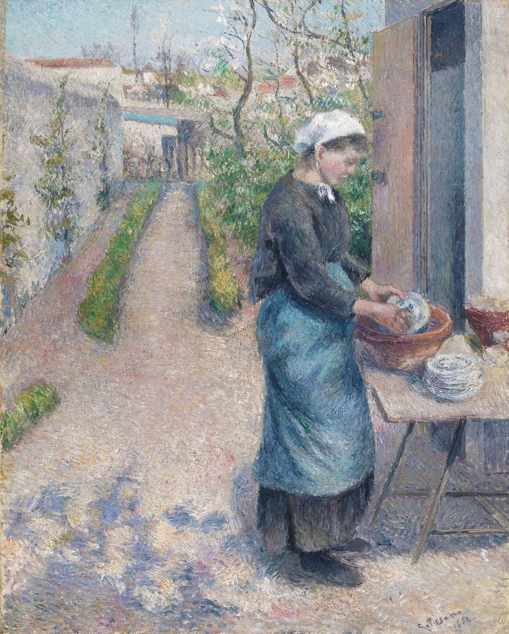 Pontoisen puutarhassa: Nuori nainen pesee astioita, 1882 tekijältä Camille Jacob Pissarro