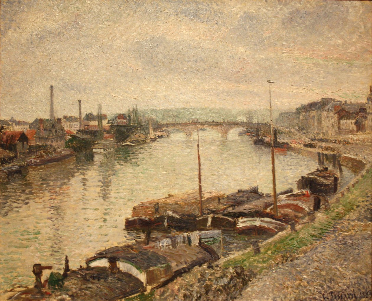 Kivisilta ja proomut Rouenissa tekijältä Camille Jacob Pissarro