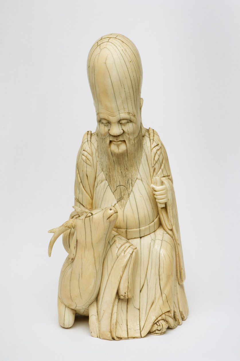 Shou Xingin kaiverrettu norsunluuhahmo istuu peuran kanssa, n. 1580-1644 tekijältä Chinese School