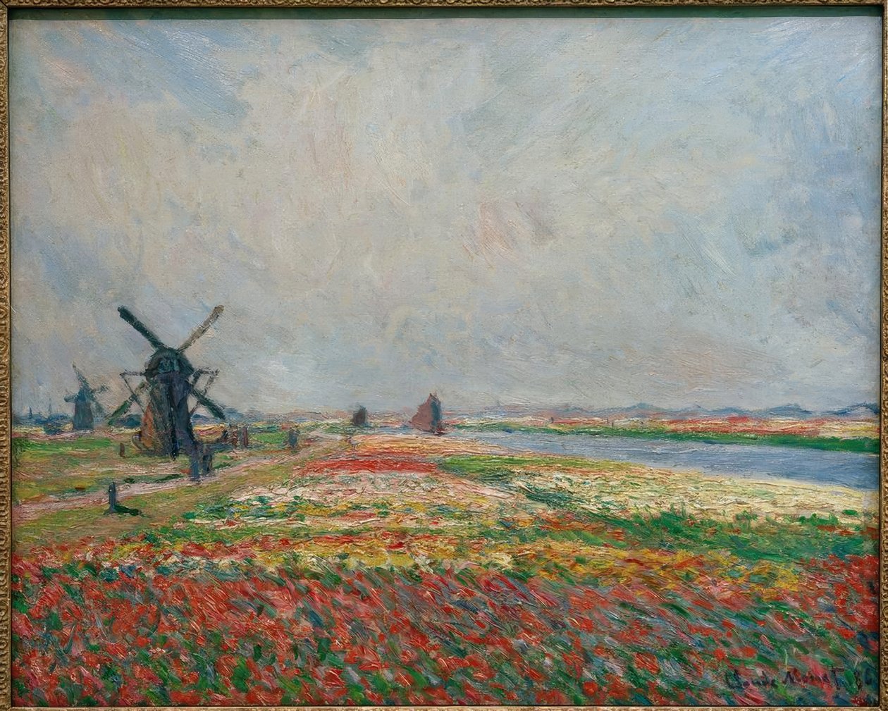 Champs de fleurs et de moulins pres de Leyde tekijältä Claude Monet