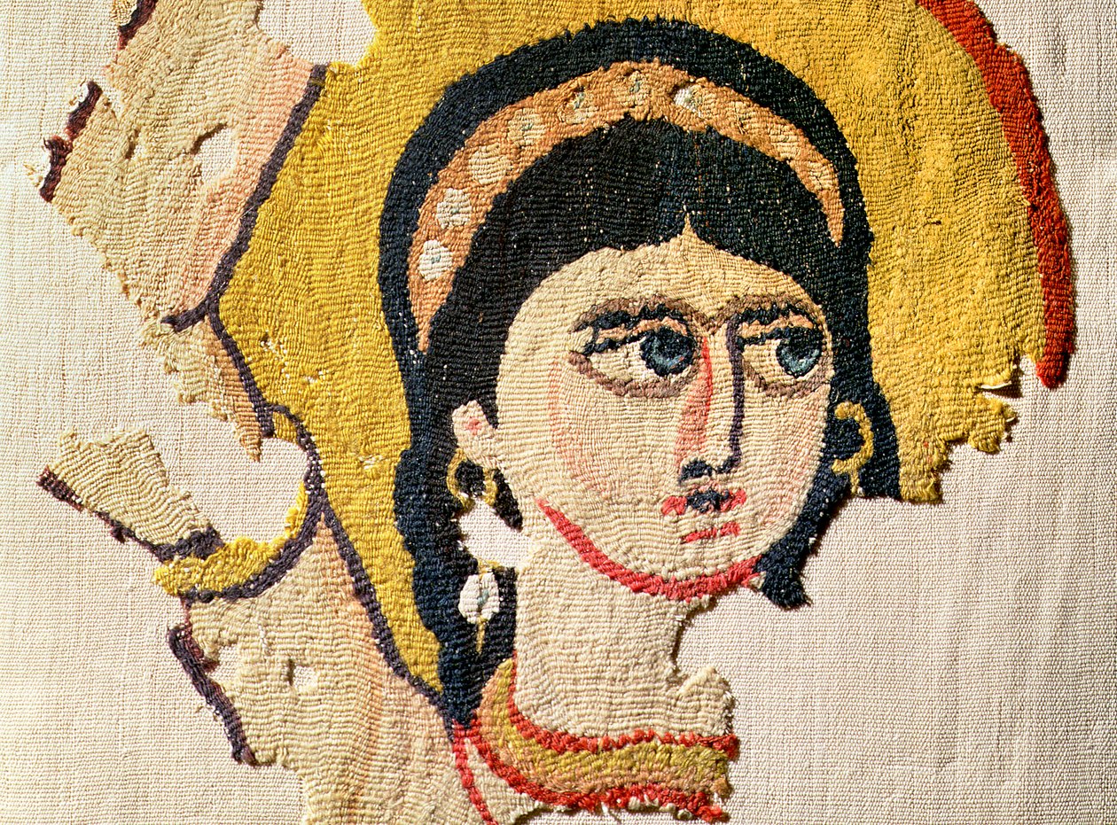 Fragmentti kuvakudoksesta, joka kuvaa tanssijan päätä villa- ja pellavayksityiskohta 107971 tekijältä Coptic