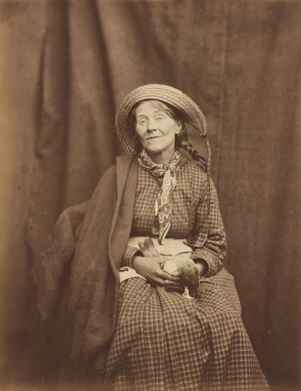 Nainen pitelee kuollutta lintua, Surrey County Asylum, n. 1855. tekijältä Dr Hugh Welch Diamond