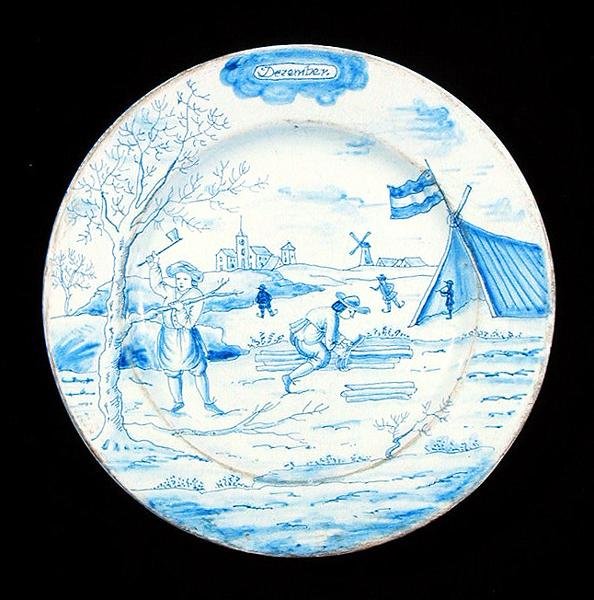 Joulukuuta esittävä Delftware-laatta (tinalasitettua saviastiaa). tekijältä Dutch School