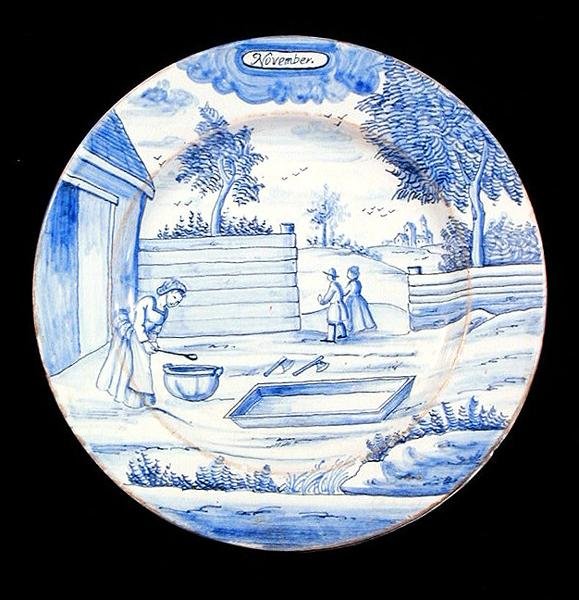 Delftware-lautanen, joka kuvaa marraskuuta (tinalasitettu keramiikka) tekijältä Dutch School