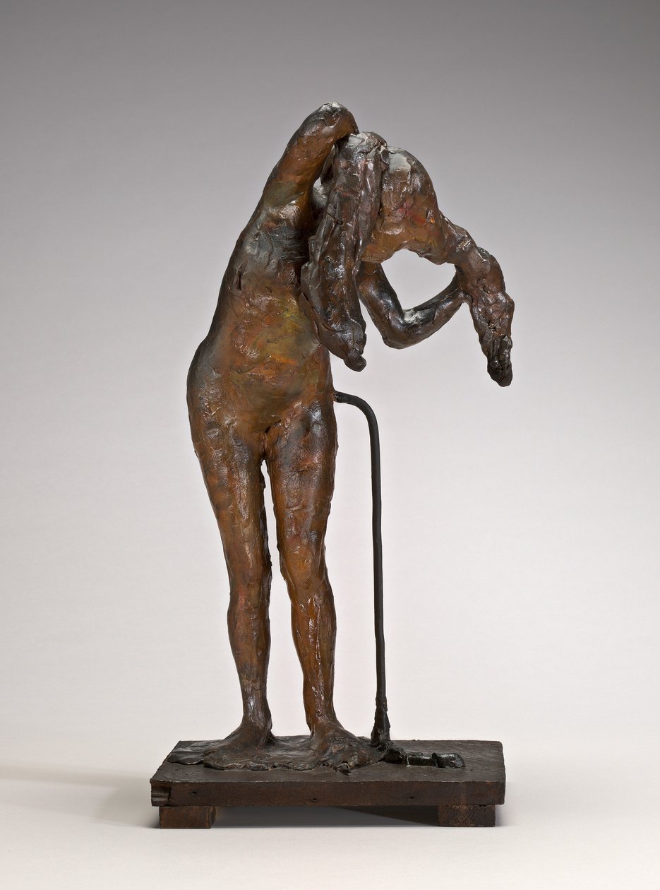 Nainen järjestämässä hiuksiaan, mahdollisesti 1880-1890-luvun lopulla. tekijältä Edgar Degas