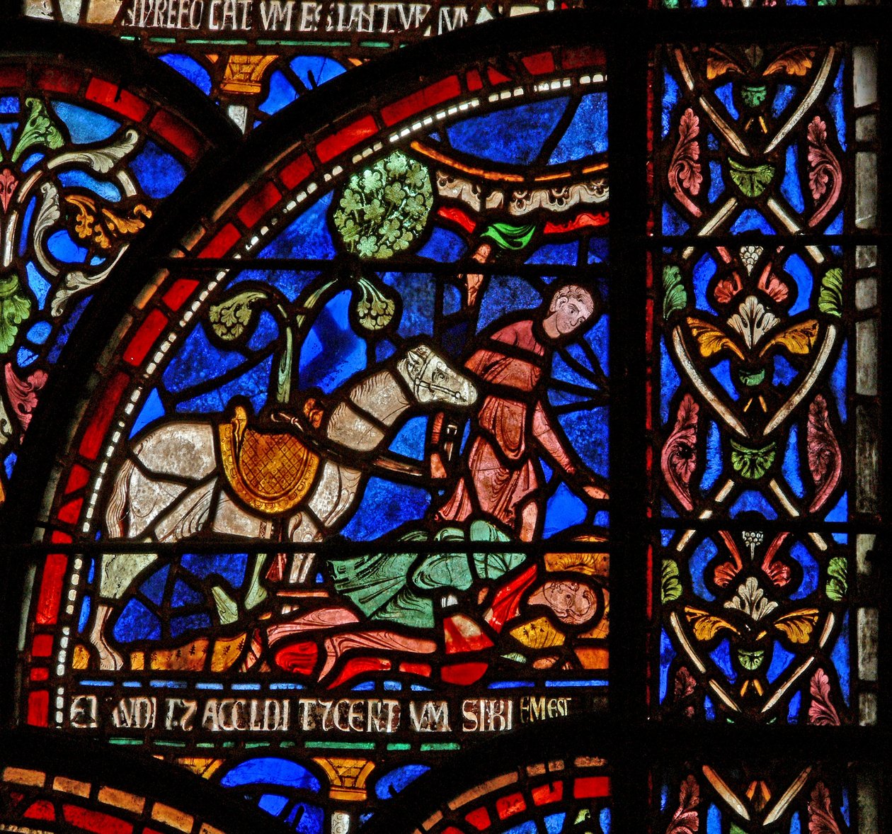 Windows 7 kuvaa kohtauksen St Thomas Becket Miracle -ikkunasta: William of Gloucester on haudattu, mutta hänen äänensä kuuluu tekijältä English School