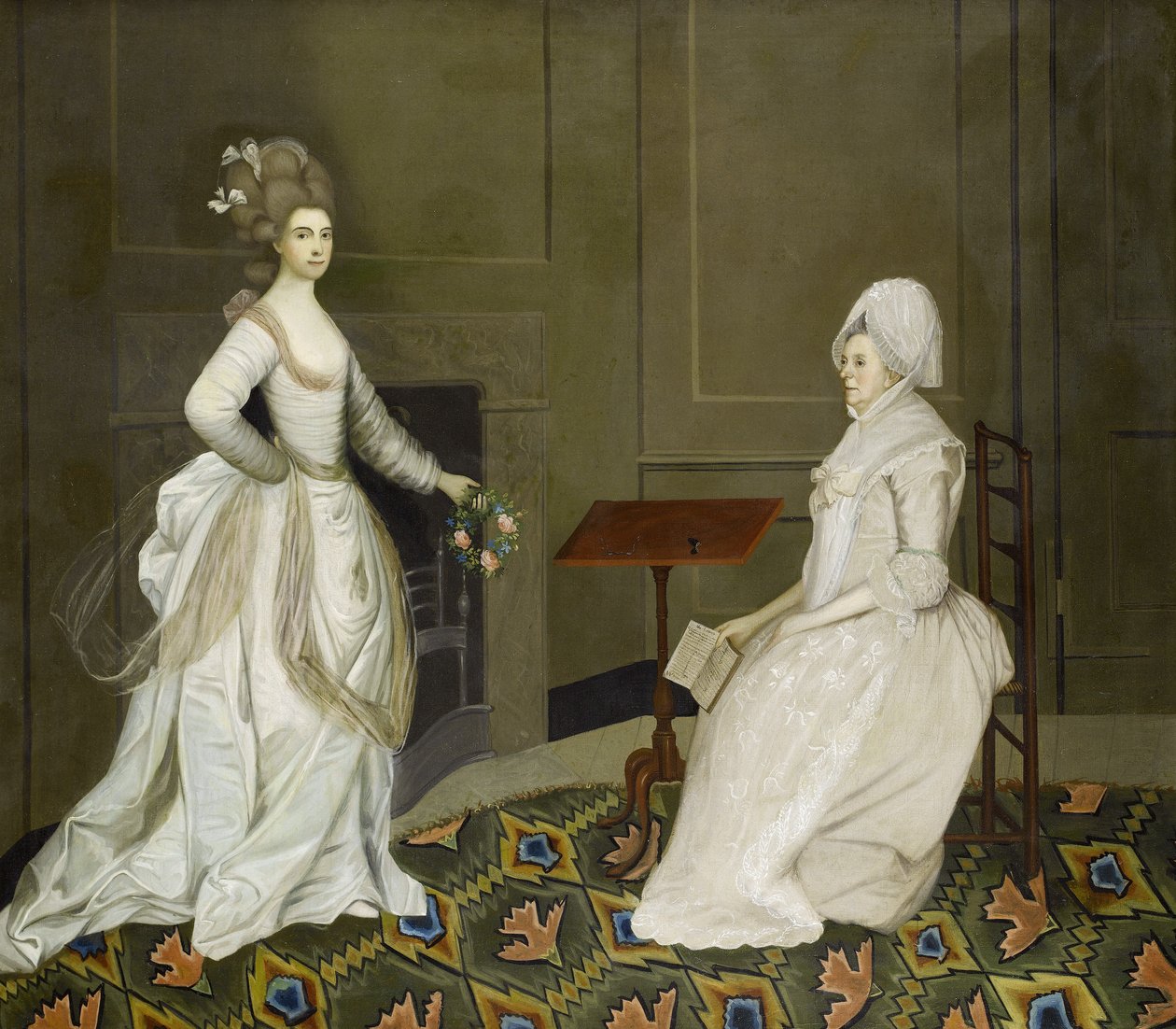 Kaksi naista sisätiloissa, toinen lukee, toisella kädessään kukkaseppele tekijältä English School, 18th Century