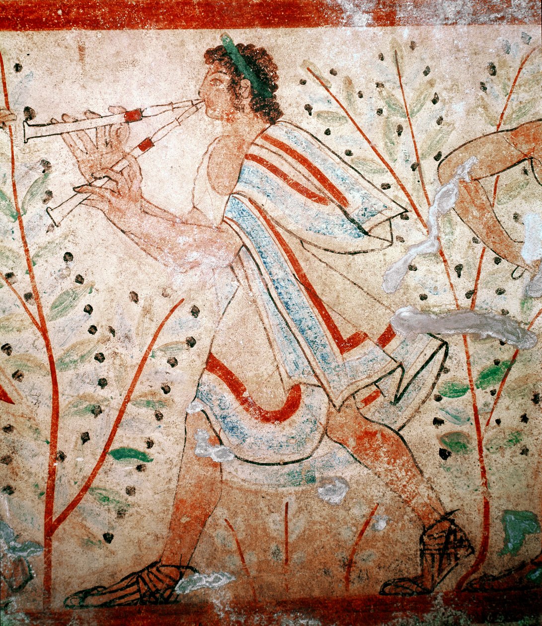 Huilun soittaja. Yksityiskohta freskon 5. vuosisadalta eKr tekijältä Etruscan