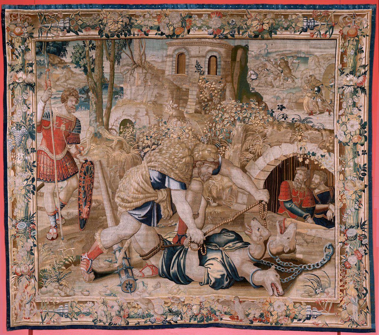 Flanderin kuvakudos. Sarja Herkuleen työt. Hercules vangitsee Cerberuksen (Hércules captura a Cancerbero). Kuudes kuvakudos säilyneestä sarjasta. Malli Tuntematon. Valmistus Willem Dermoyen, Bryssel. Ca1528. Kangas Silkki ja villa. Koko 345 x 390 cm. Locat tekijältä Flemish School