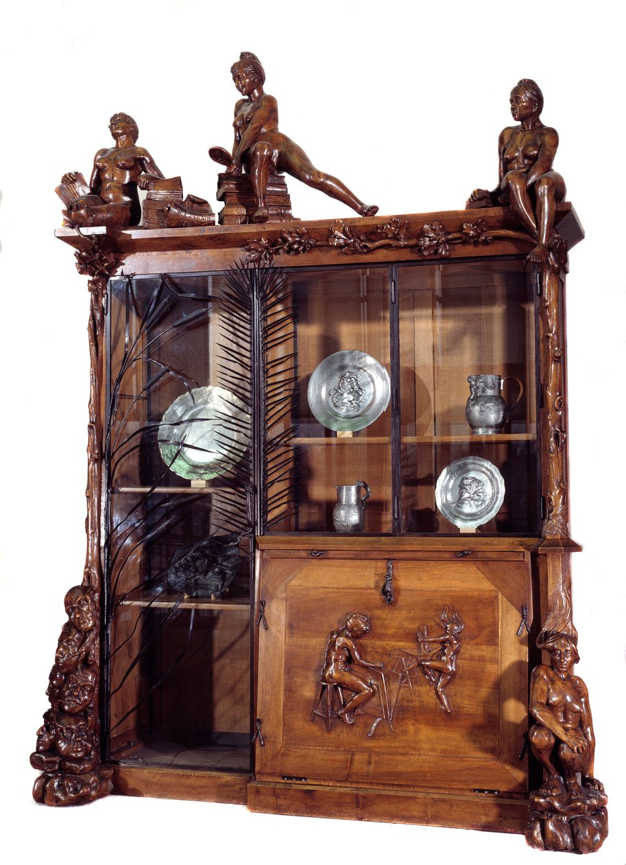 Huonekalut: saksanpähkinä- ja takorautakirjahylly, valmistaja Francois Hubert Carabin (1862-1932) 1890 su. 2,9 m Pariisi. Orsay-museo tekijältä Francois Rupert Carabin