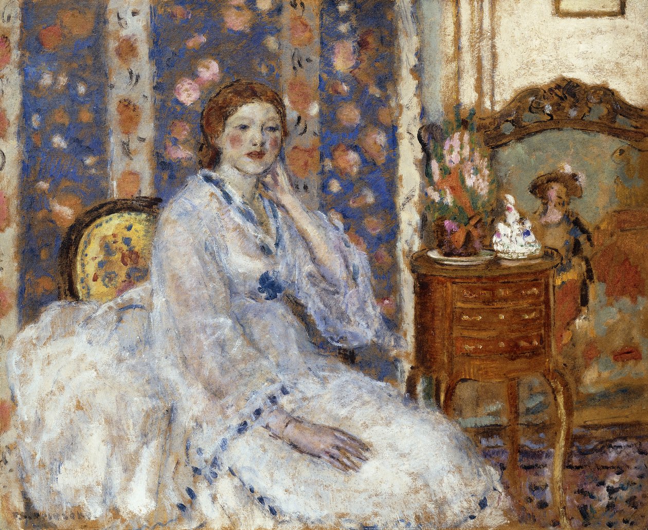 Nainen istuu nojatuolissa tekijältä Frederick Carl Frieseke