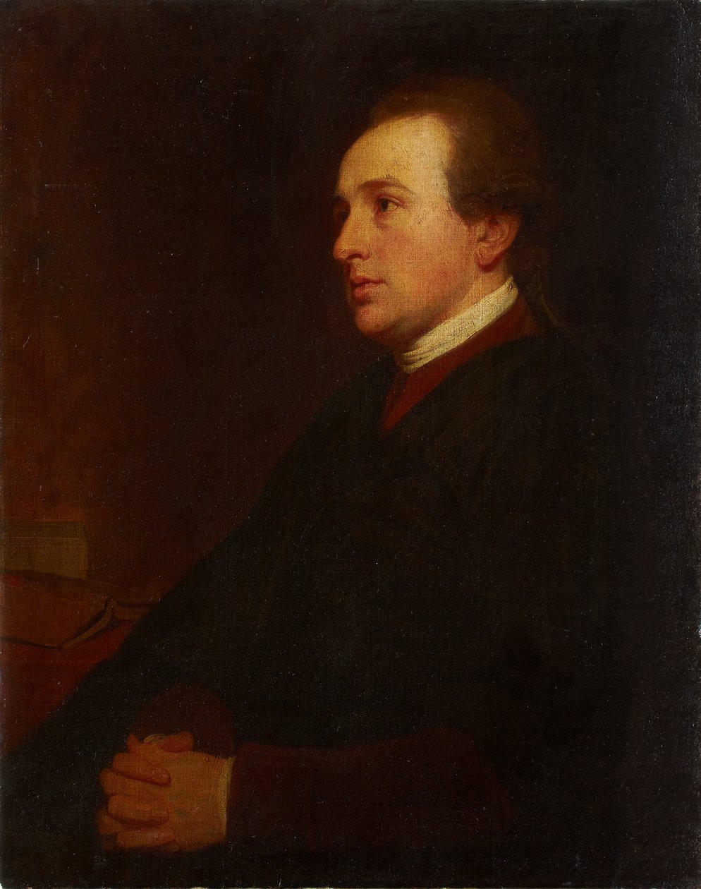 Nuoren miehen muotokuva työpöytänsä ääressä tekijältä George Romney