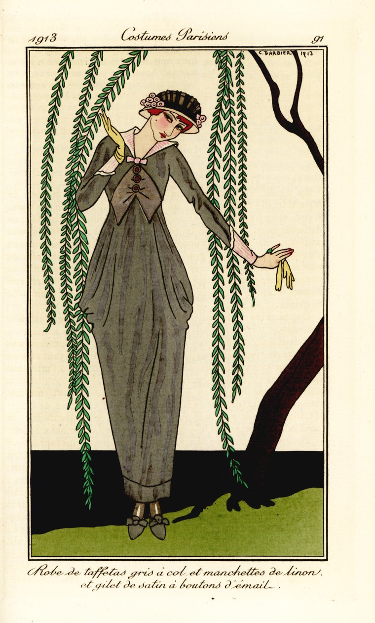 Nainen harmaassa taftimekossa, jossa pellavakaulus ja hihansuut, satiininen liivi emalinapeilla, pajupuun alla. Robe de taffetas gris a col et manchettes de linon, et gilet de satin a boutons d’email. Käsinvärinen pochoir (stensiili) etsaus kuvituksen jälk tekijältä Georges Barbier