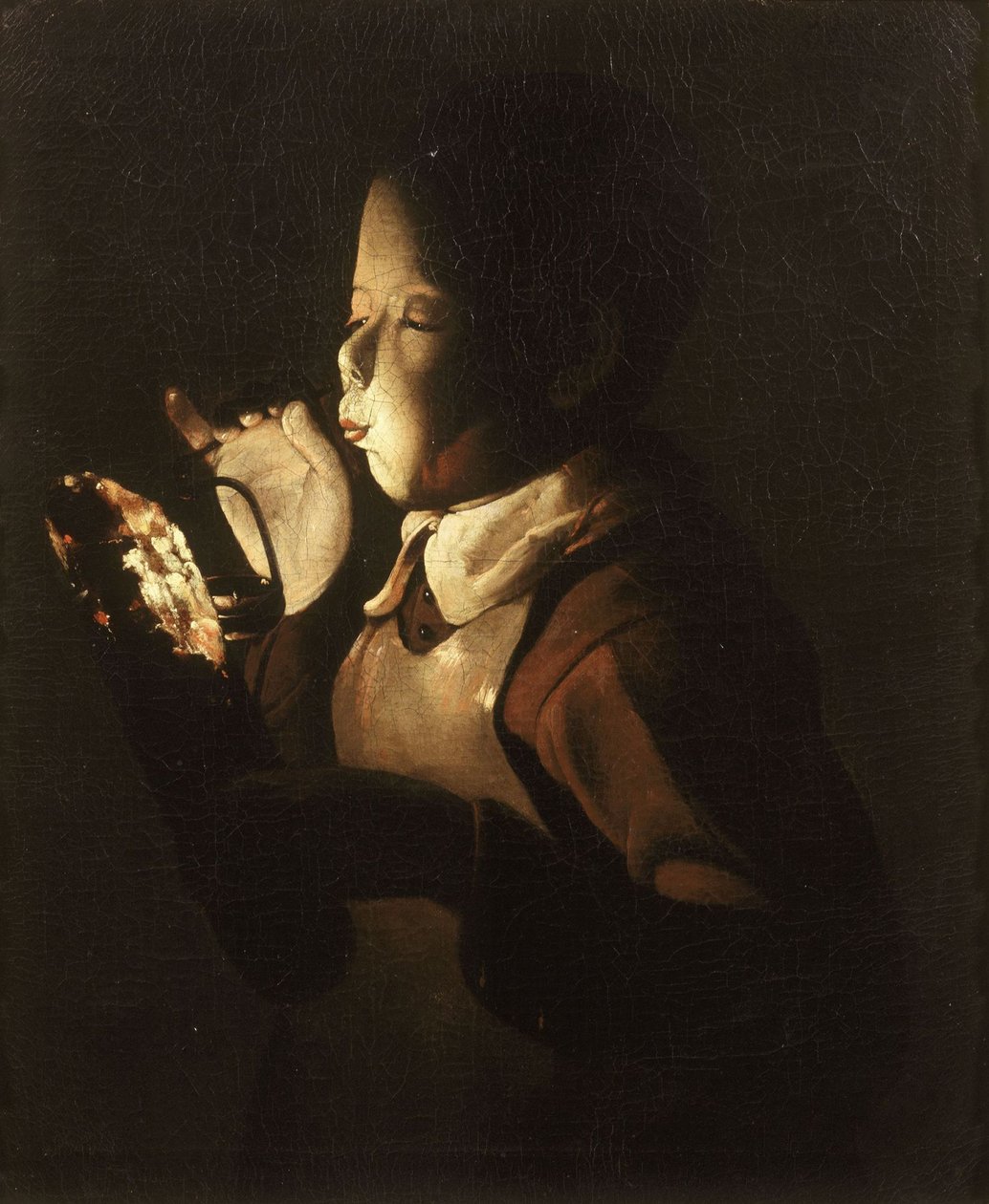 Poika puhaltaa lampussa tekijältä Georges de La Tour
