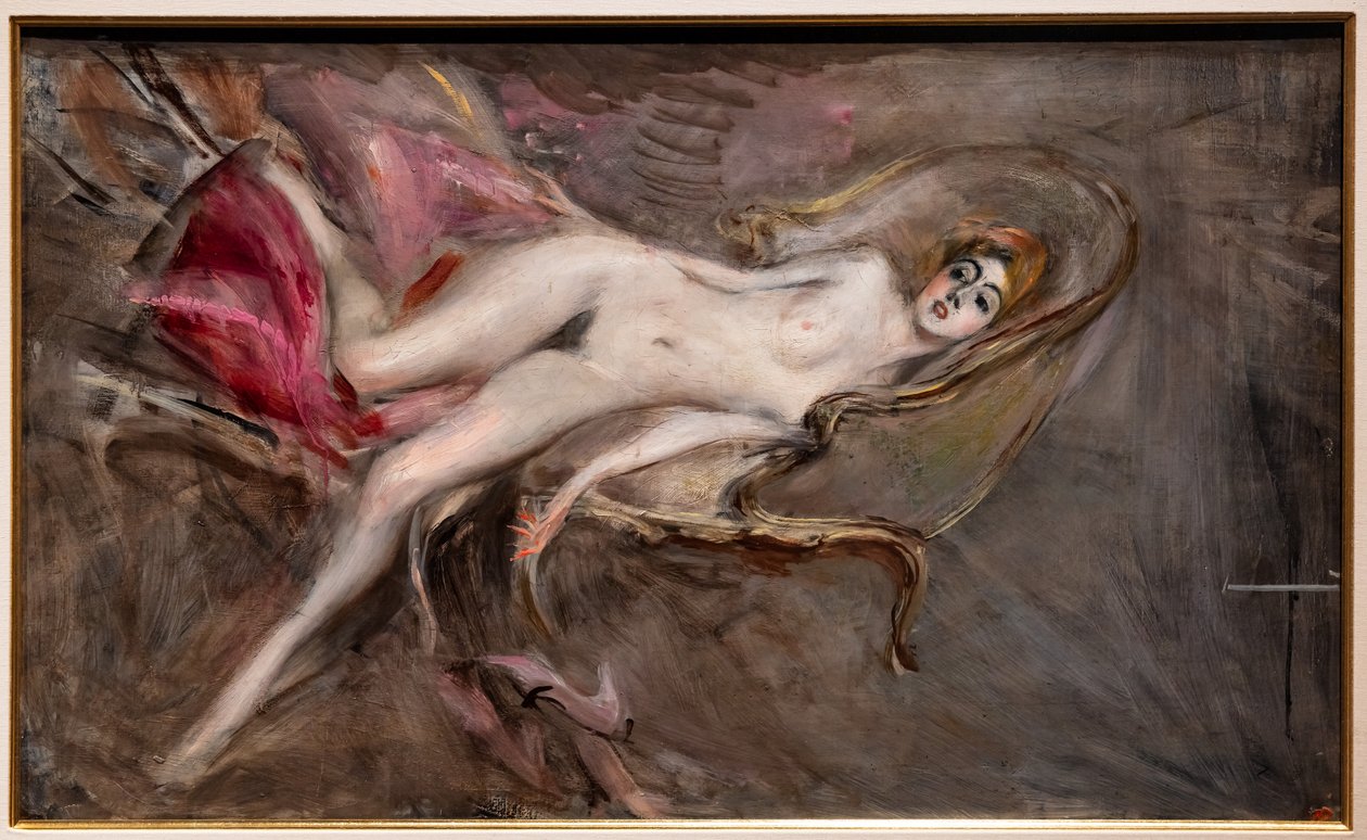 Alaston nainen vaaleanpunaisilla tyynyillä tekijältä Giovanni Boldini