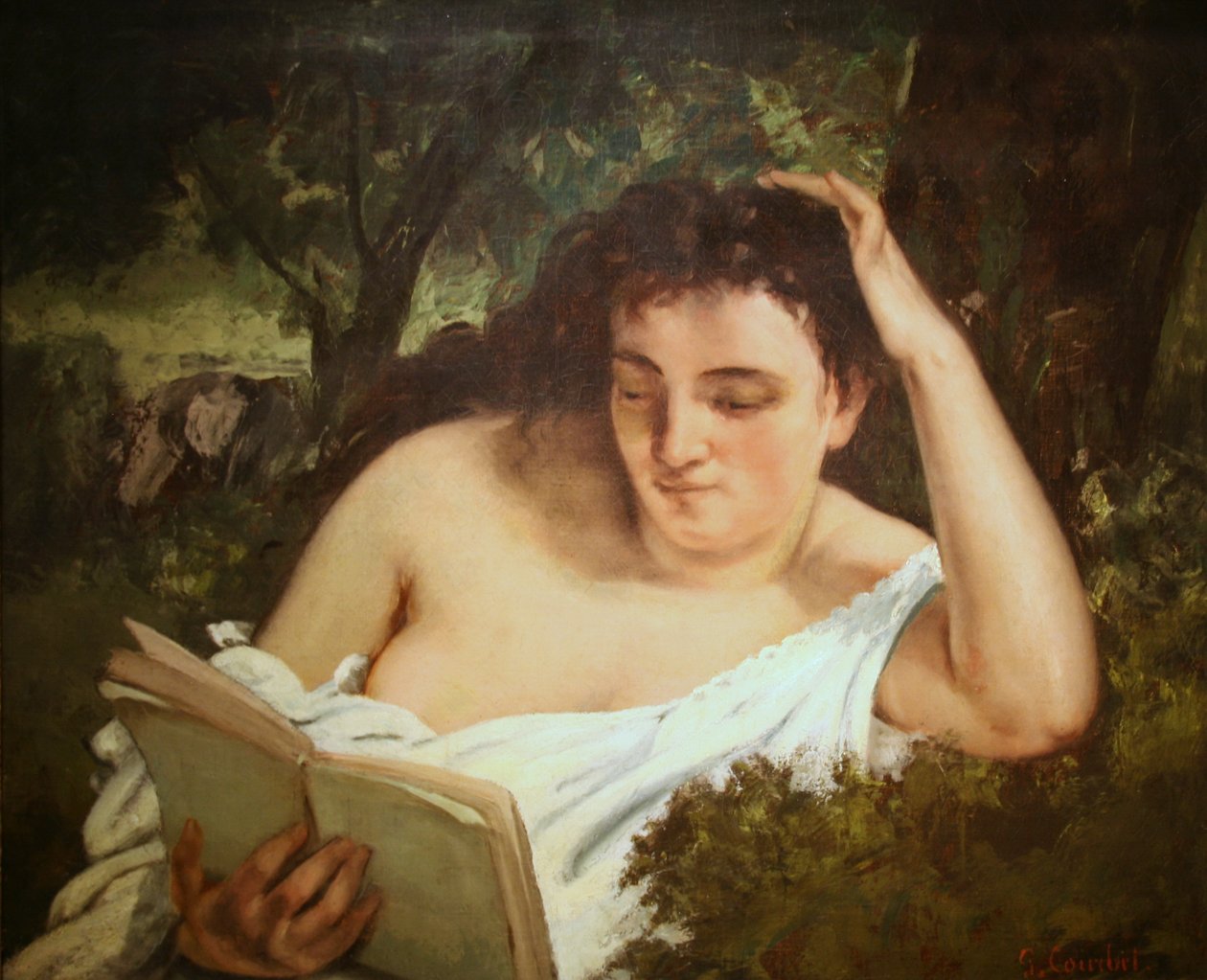 Nuori nainen lukemassa tekijältä Gustave Courbet