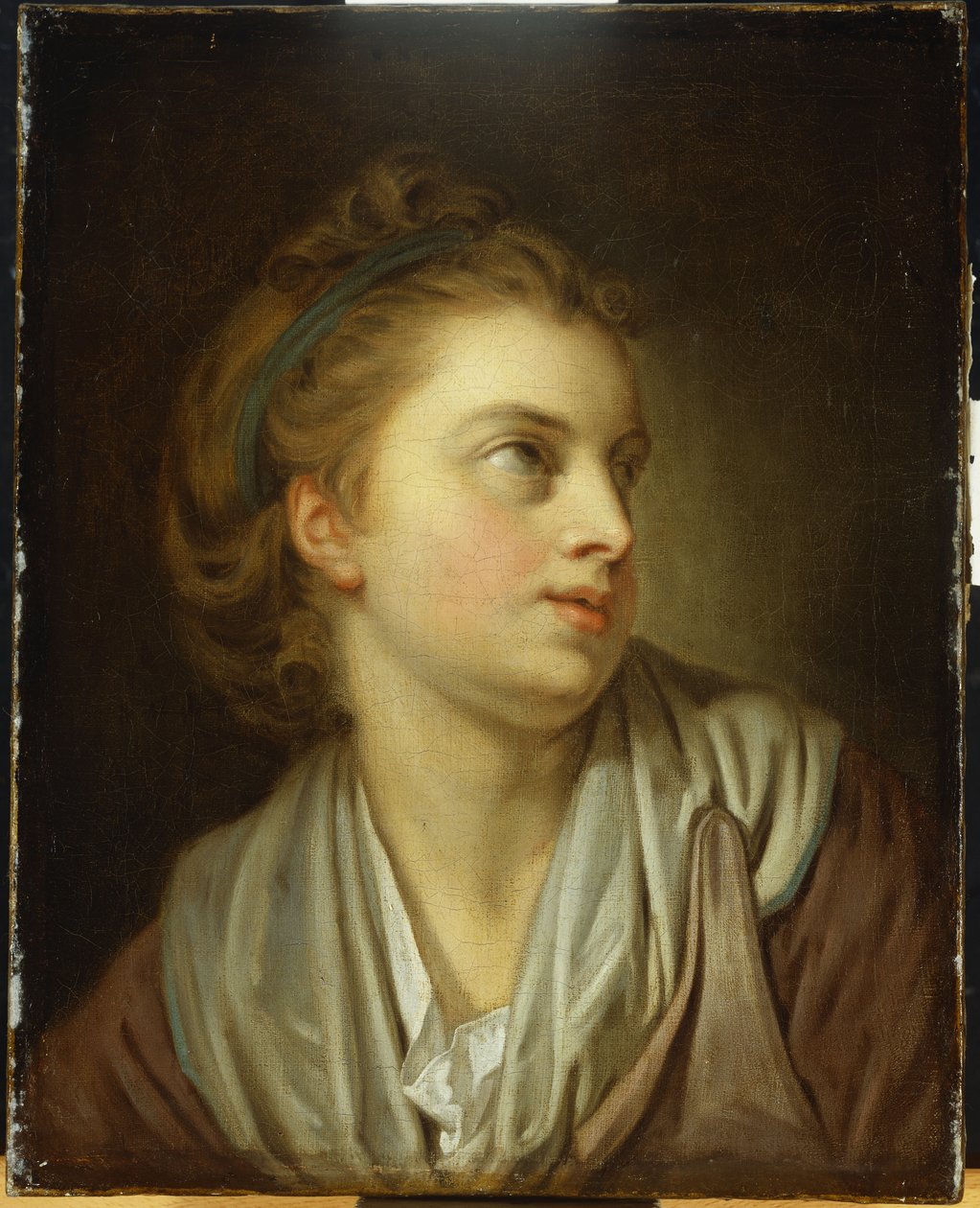 Tyttö, rinnan pituinen, vihreä hiusnauha, joka katsoo ylöspäin tekijältä Jean Baptiste Greuze