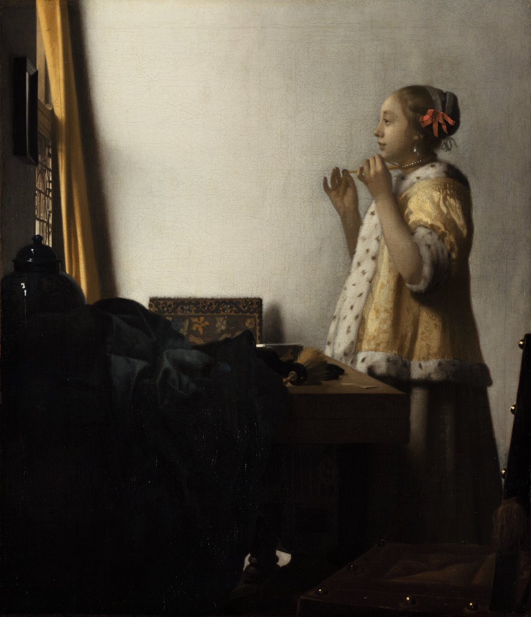Nuori nainen, jolla on helmikaulakoru tekijältä Johannes Vermeer