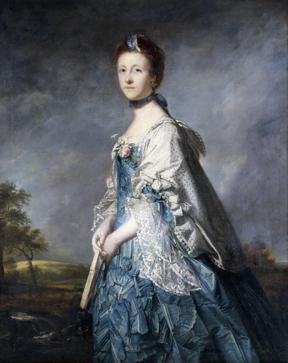 Muotokuva Annesta, kreivitär Wintertonista, seisomassa kolme neljäsosaa, yllään sininen mekko ja pitsireunattu huivi, pitelee tuuletinta, maisemassa, tekijältä Joshua Reynolds
