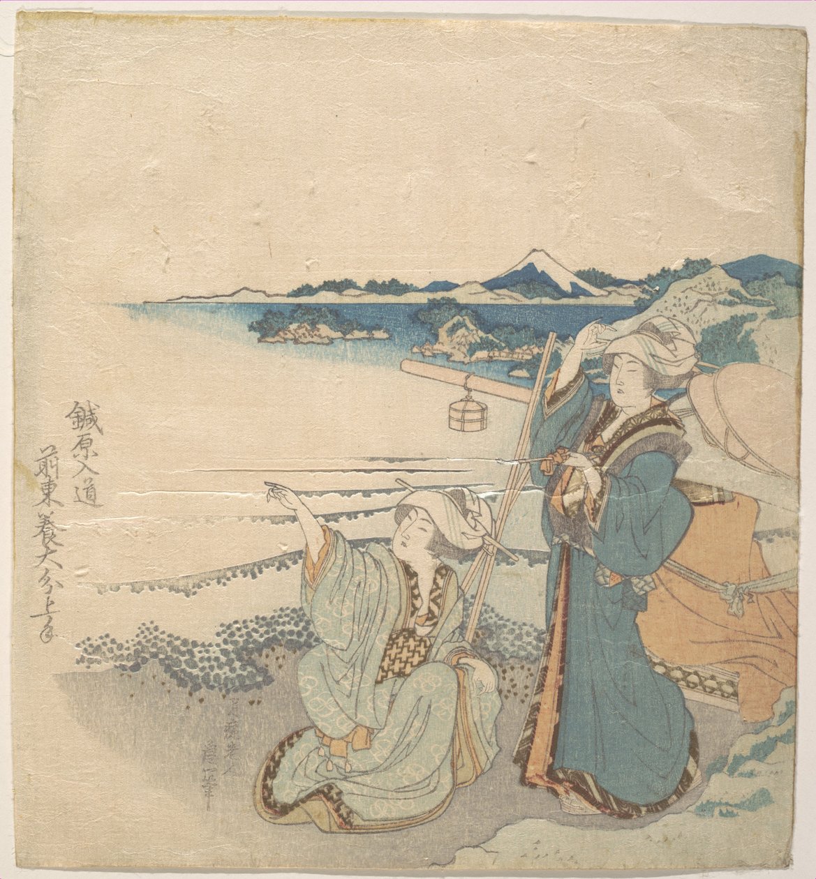 Kaksi nuorta naista rannalla; toinen osoittaa tekijältä Katsushika Hokusai