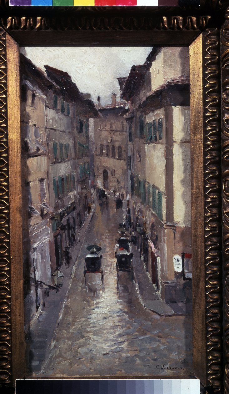 Sade Firenzessä (Rain Firenzessä). Kuvaus kadusta Toscanan (Italia) kaupungin keskiaikaisessa keskustassa. Maalaus Konstantin Aleksejevitš Korovin (Konstantin Korovin) (1861-1939), öljy kankaalle tekijältä Konstantin Alekseevich Korovin