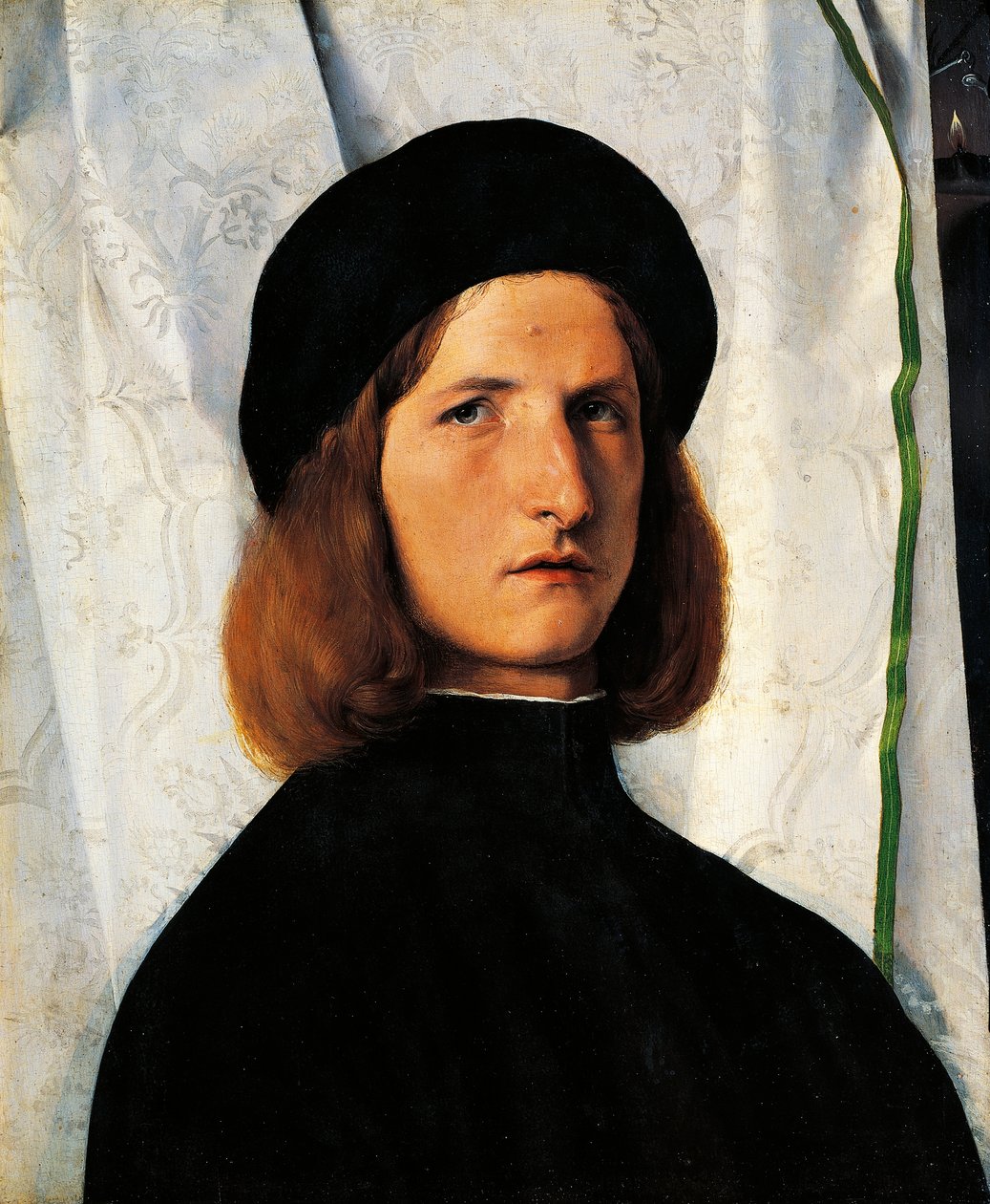 Nuoren miehen muotokuva lampun kanssa tekijältä Lorenzo Lotto
