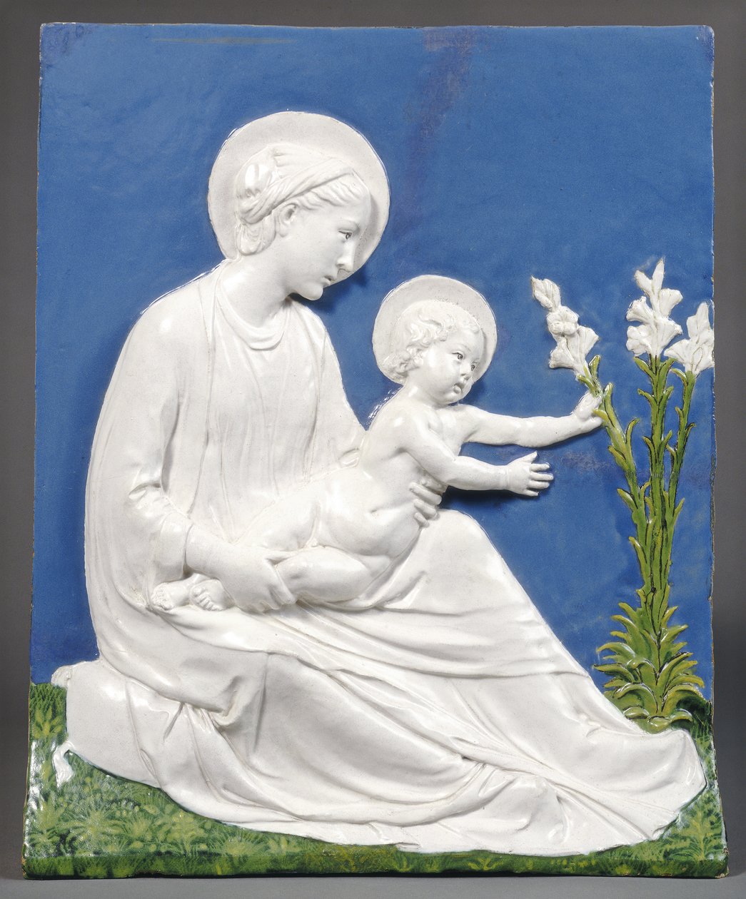 Madonna und Child, n. 1475 (lasitettu terrakotta) tekijältä Luca Della Robbia