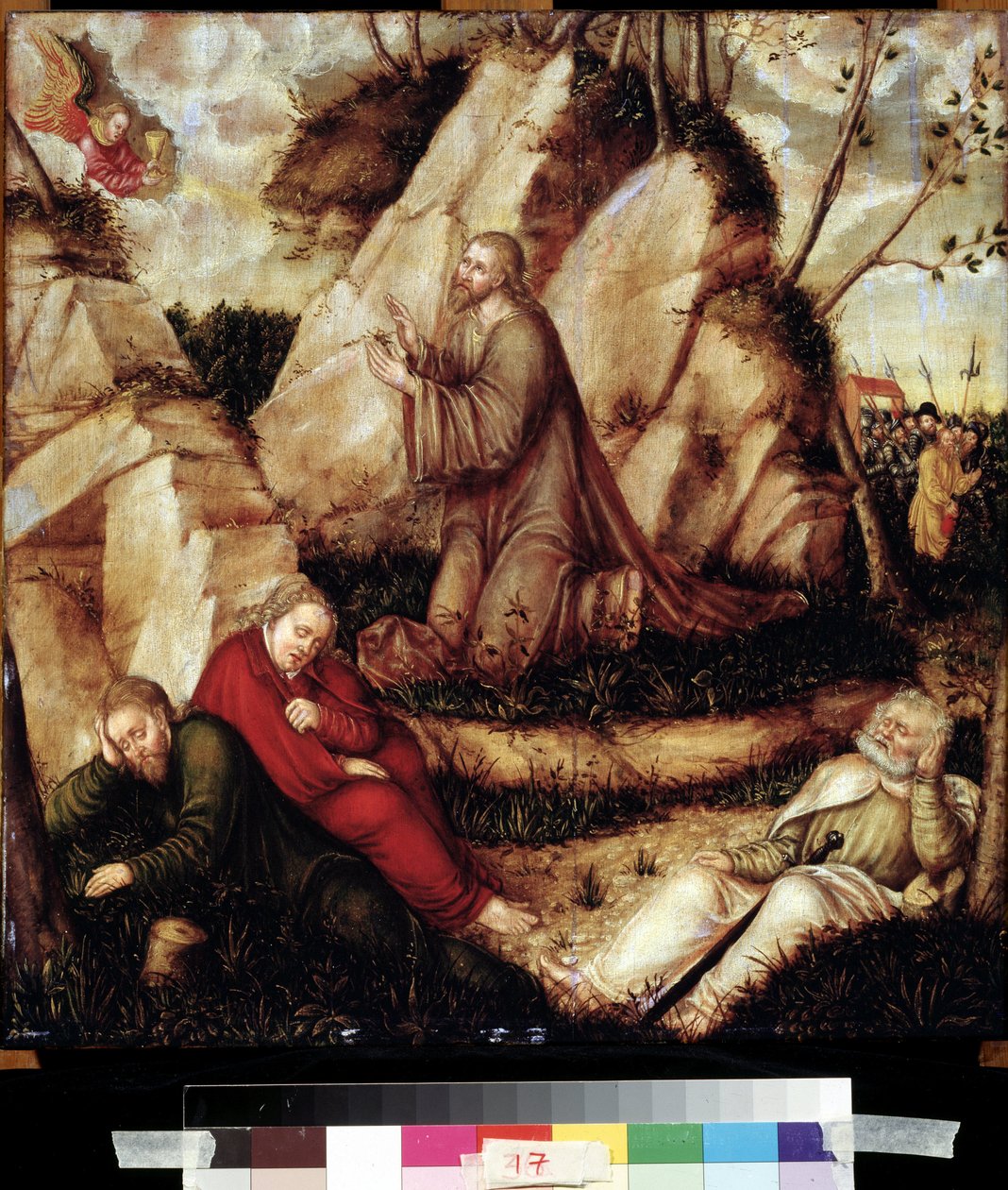 ""Rukous öljypuutarhassa"" (Agony in the Garden) Viimeisen illallisen jälkeen Kristus menee Getsemanen kukkulalle, joka hallitsee Jerusalemia apostolien kanssa. Roomalaiset sotilaat Juudaksen avustajat lähestyvät pidättääkseen hänet. Maalaus puulle merkilt tekijältä Lucas the Elder Cranach