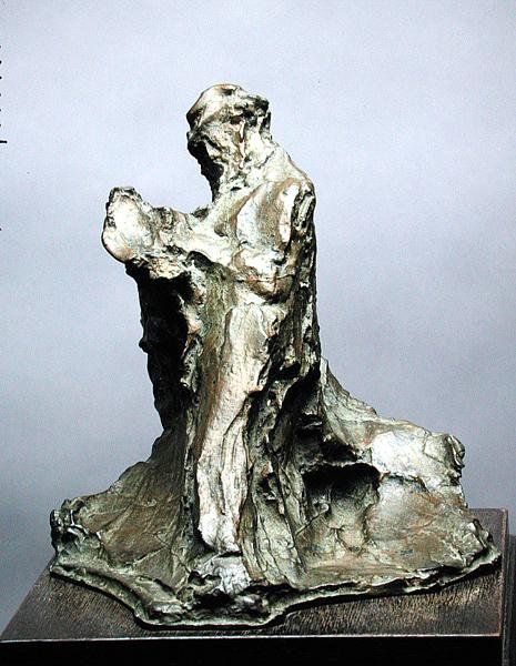 Mies lukeva (vaikutus siitä, että mies lukee sanomalehteä) tekijältä Medardo Rosso