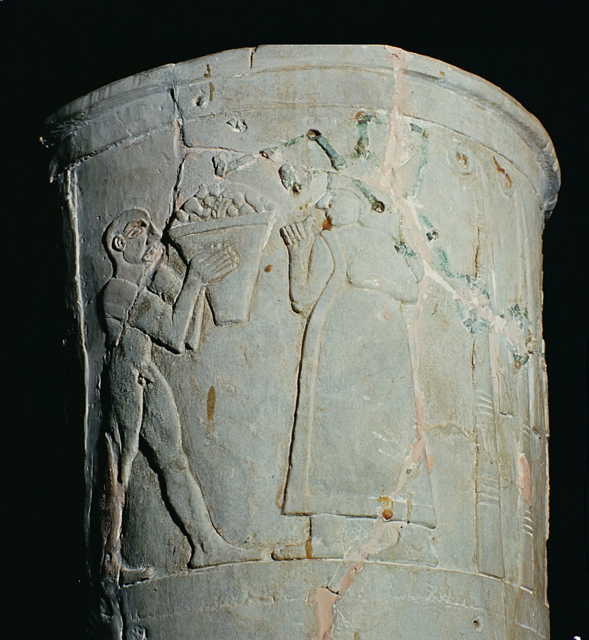 Maljakko, jossa mies kantaa hedelmäkulhoa (saviastia). tekijältä Mesopotamian