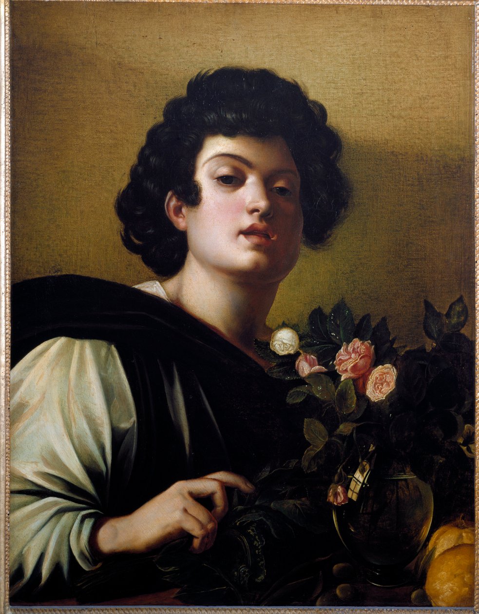 Nuori poika ruusumaljakossa tekijältä Michelangelo Merisi da Caravaggio