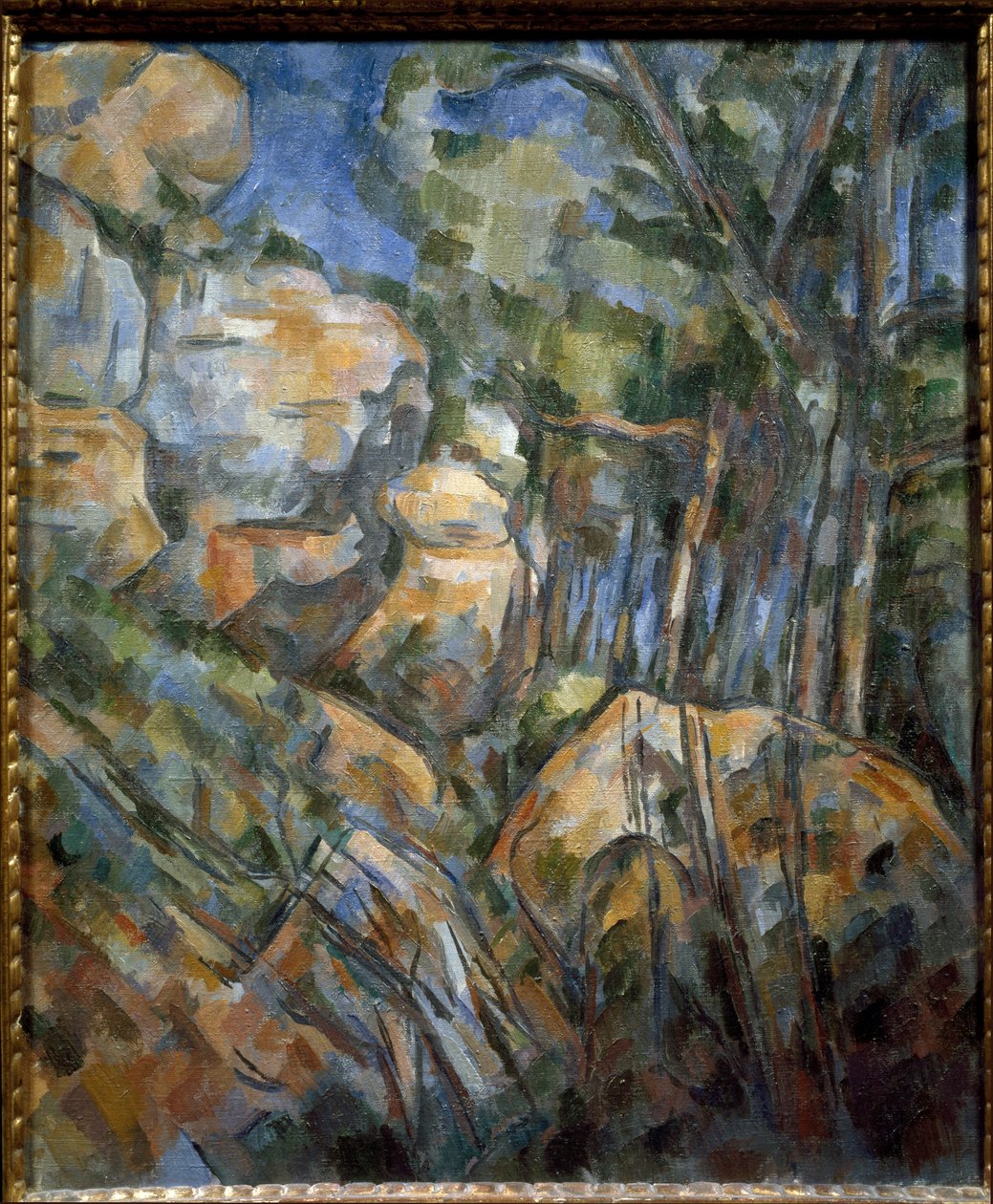 Kivet lähellä Chateau Noirin yläpuolella olevia luolia (öljy kankaalle, noin 1904) tekijältä Paul Cézanne