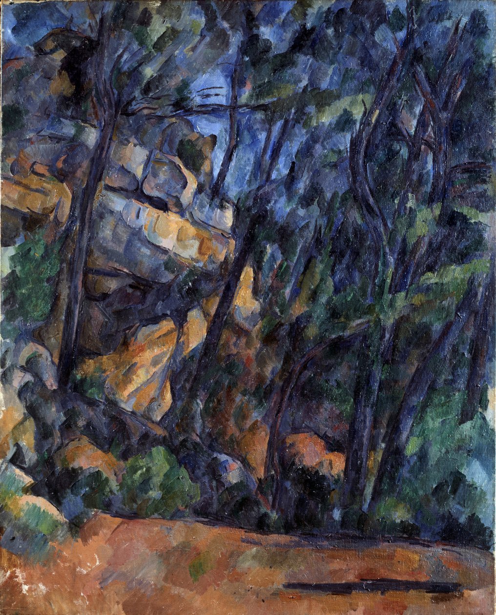 Puut ja kivet Château Noirin puistossa, noin 1904. tekijältä Paul Cézanne