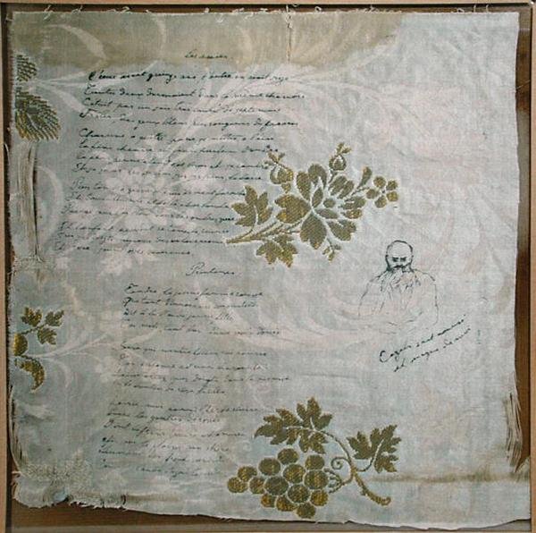 Pöytäliina, jolle Verlaine on kirjoittanut runonsa "Les Amies" ja "Le Printemps", jossa Cazalsin muotokuva Verlainesta (kynä ja muste kankaalle) tekijältä Paul Verlaine