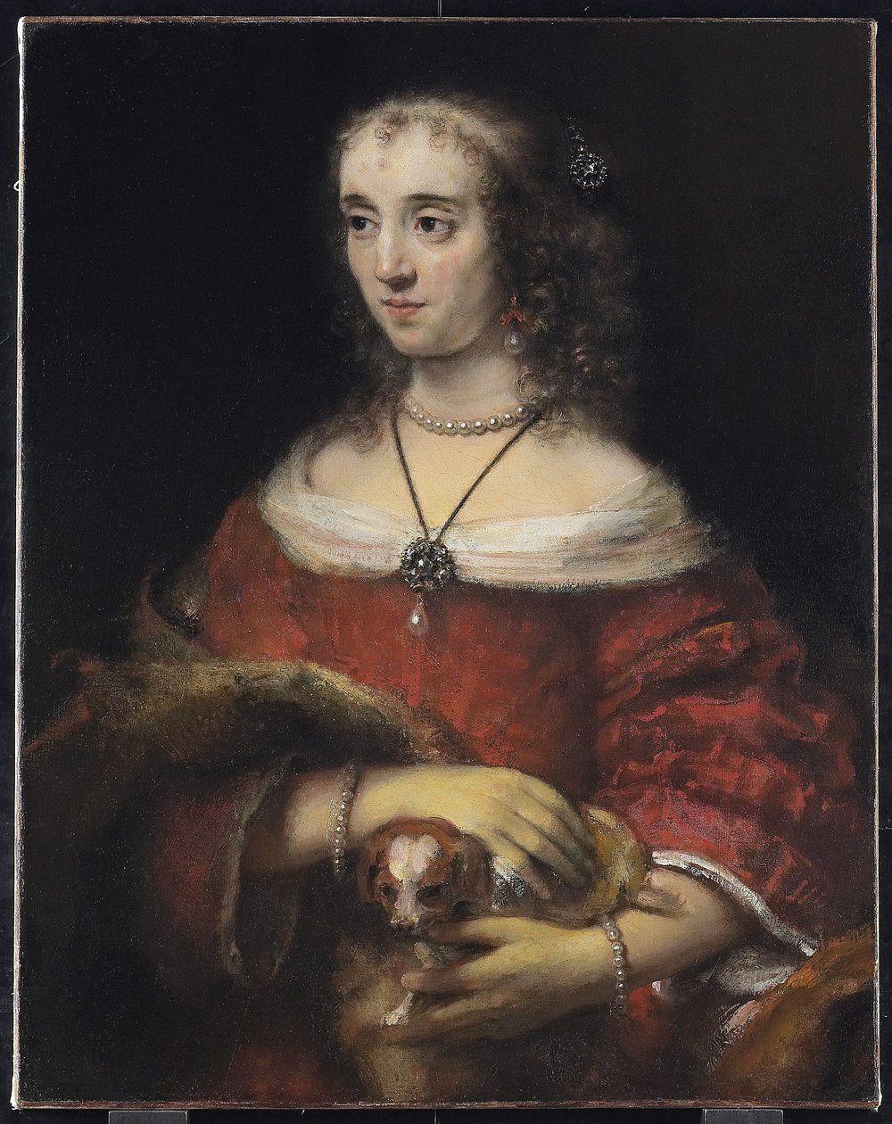 Muotokuva naisesta sylikoiran kanssa, n. 1665 tekijältä Rembrandt van Rijn