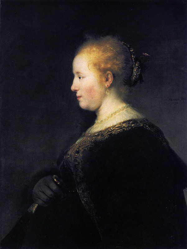 Nuori nainen profiilissa tuulettimen kanssa tekijältä Rembrandt van Rijn