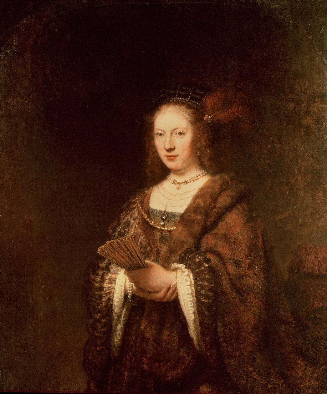 Nainen tuulettimen kanssa tekijältä Rembrandt van Rijn