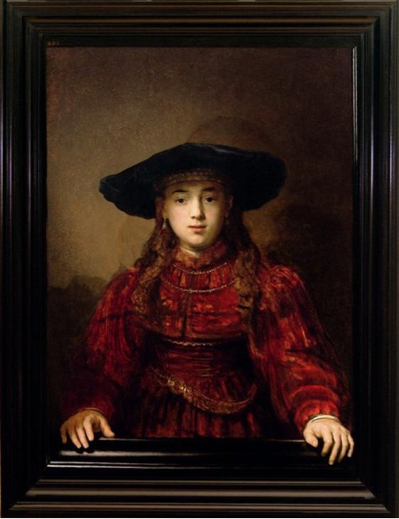 Tyttö kuvakehyksessä tekijältä Rembrandt van Rijn