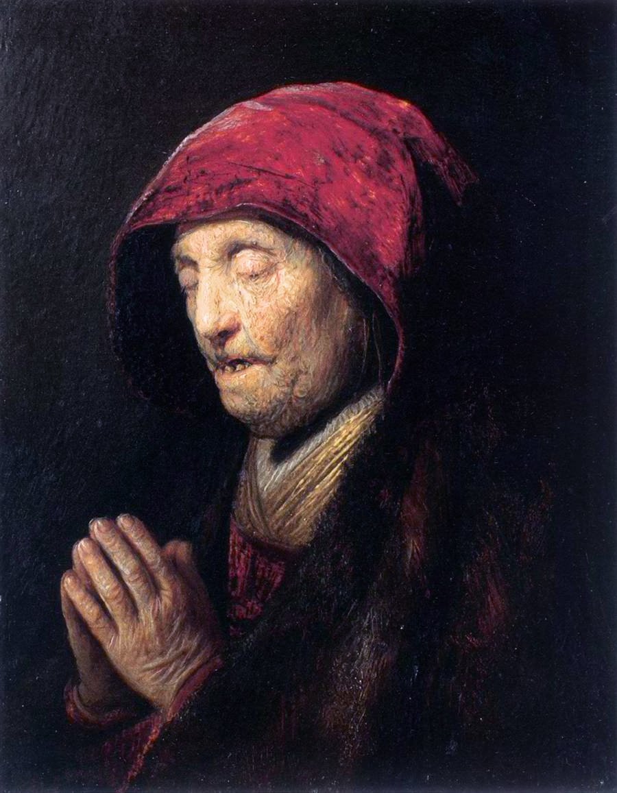 Vanha nainen rukoilee tekijältä Rembrandt van Rijn