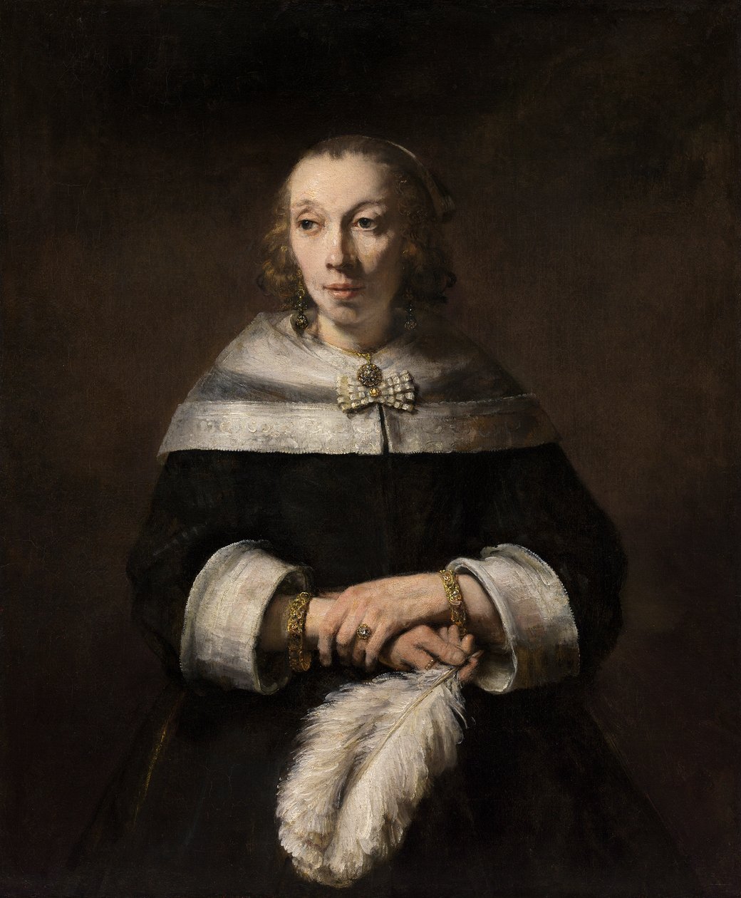 Muotokuva naisesta, jolla on strutsi-sulka-tuuletin tekijältä Rembrandt van Rijn