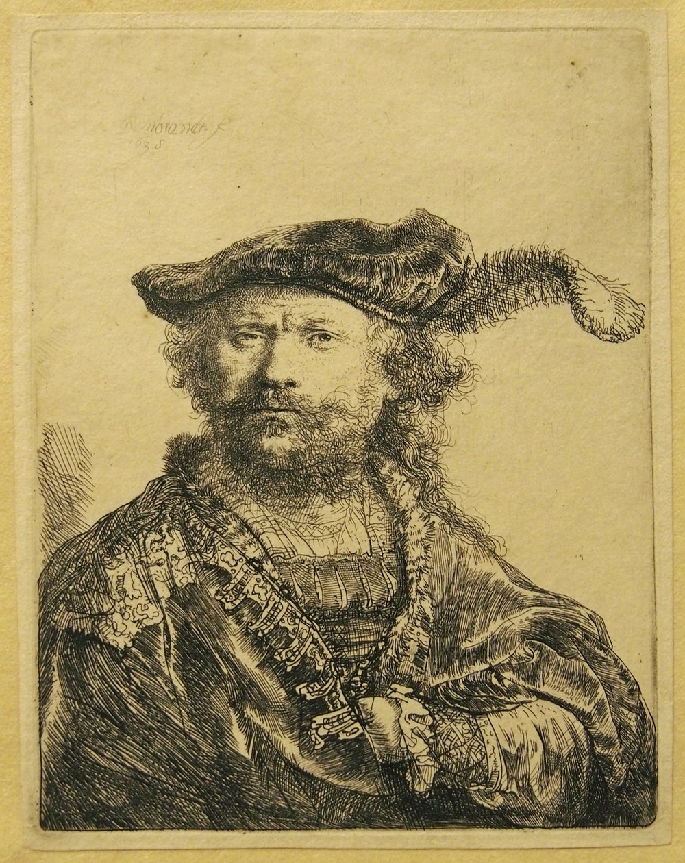 Omakuva, jossa höyhen korkissaan tekijältä Rembrandt van Rijn