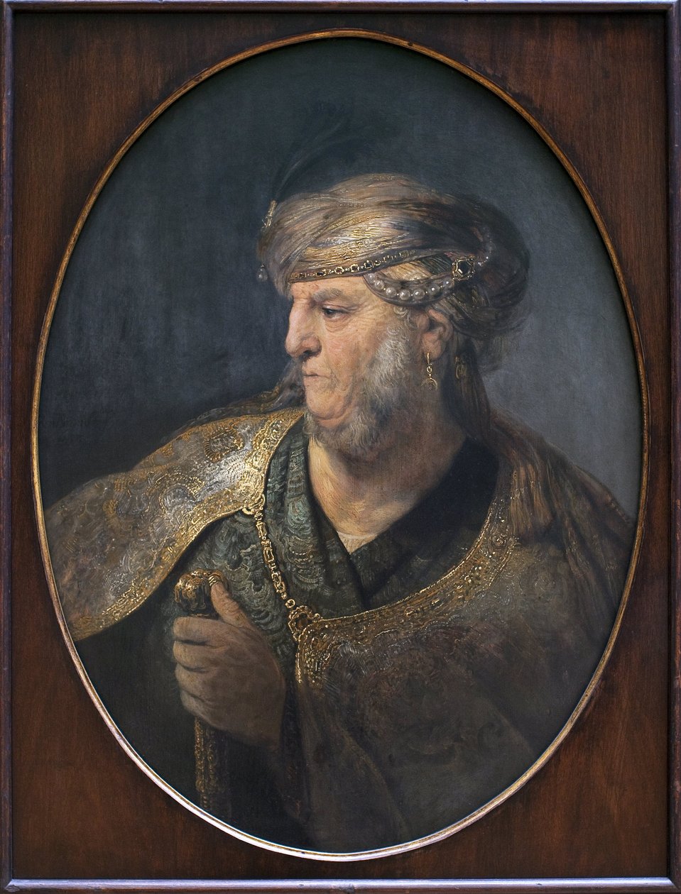 Miehen muotokuva itämaisessa puvussa. Rembrandt Harmenszoon van Rijnin (1606-1669) maalaus Öljy kankaalle tekijältä Rembrandt van Rijn