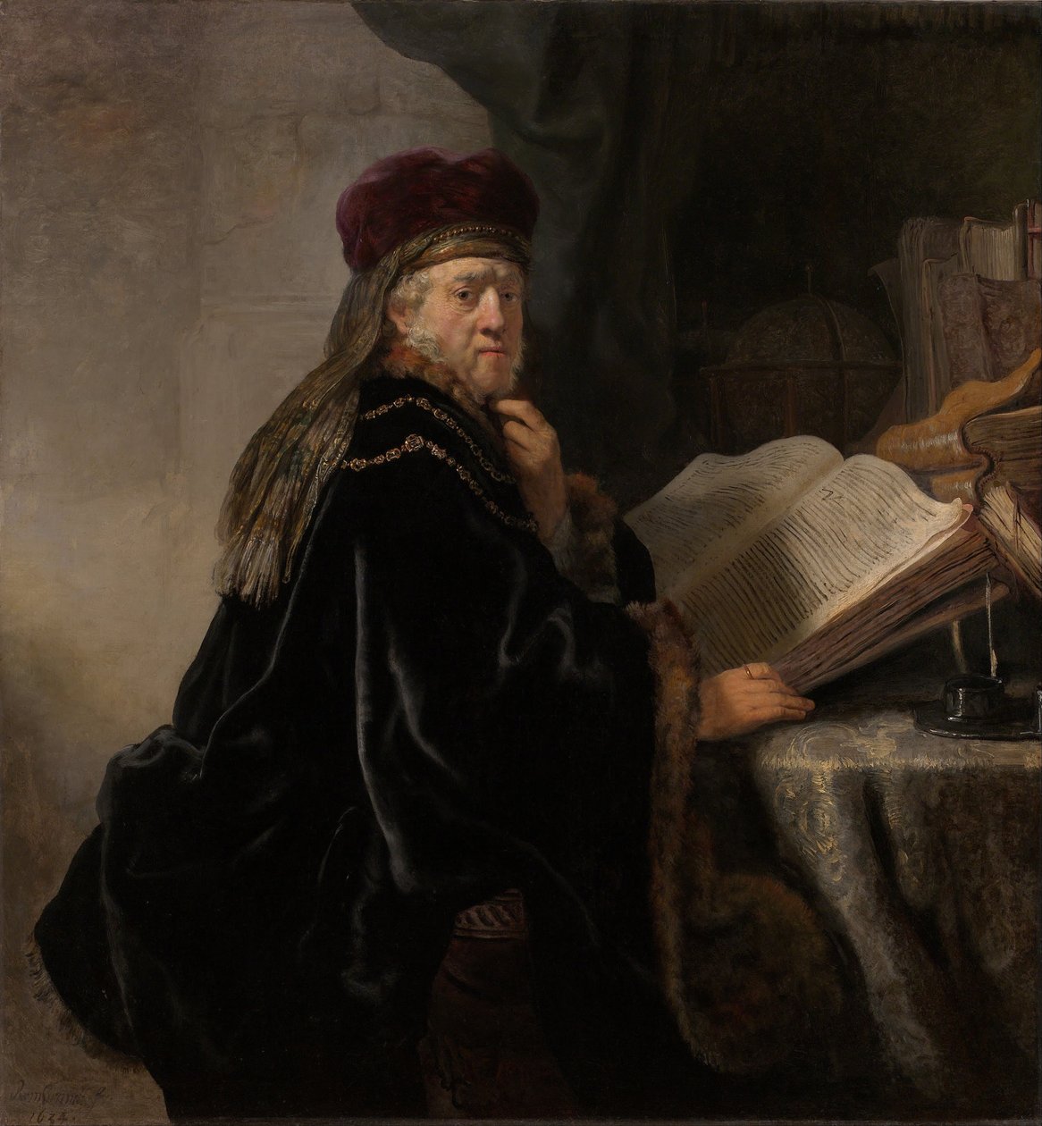Pöydän ääressä oleva tutkija Tutkija työhuoneessaan tekijältä Rembrandt van Rijn