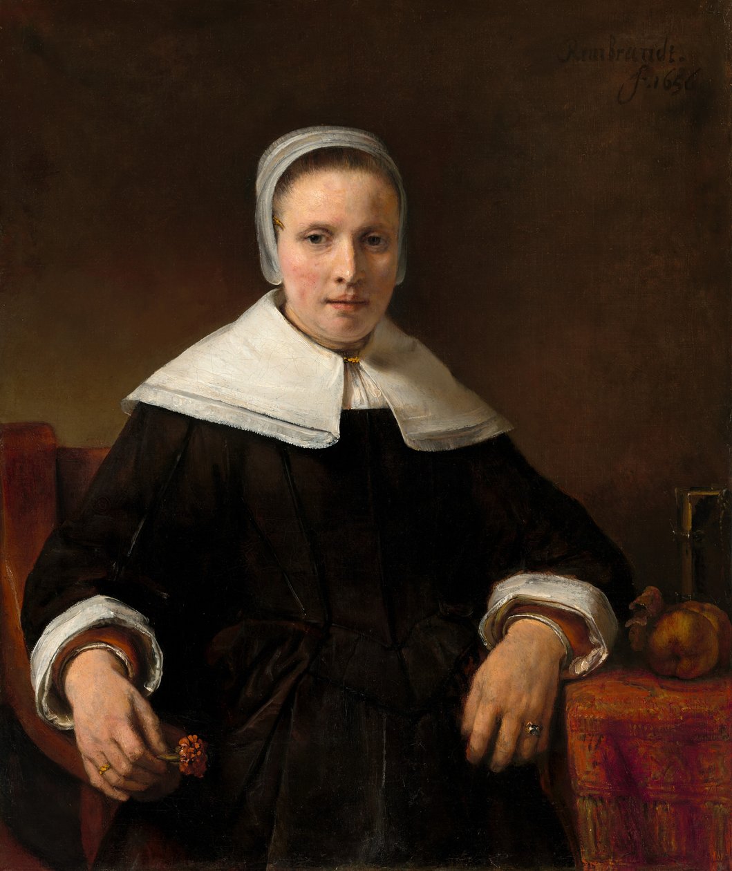 Nainen pitelee vaaleanpunaista tekijältä Rembrandt van Rijn