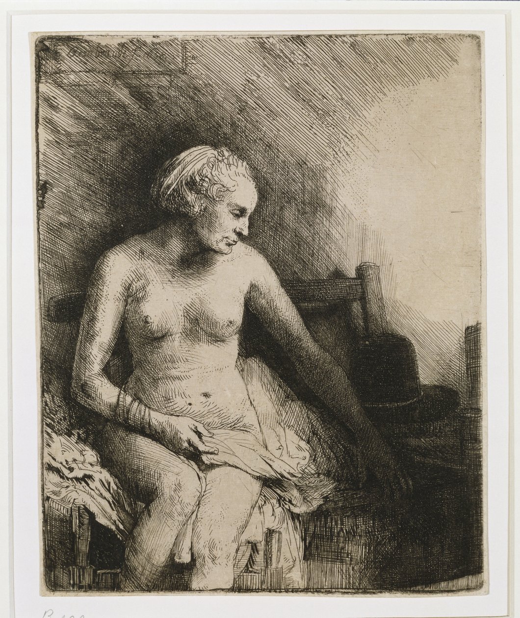 Nainen kylvyssä hattu vieressä, 1658 tekijältä Rembrandt van Rijn