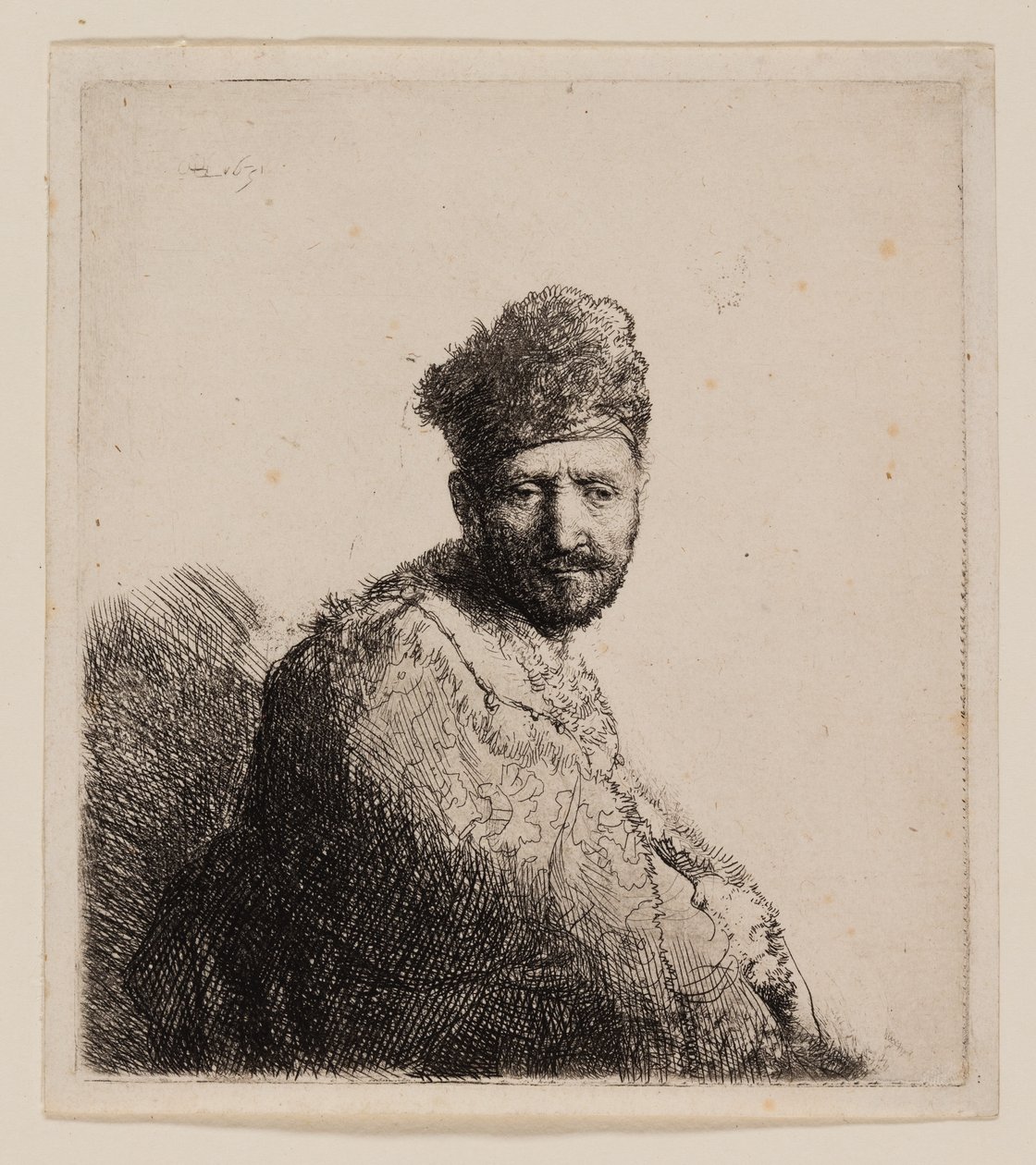Parrakas mies karvaisessa itämaisessa lippassa ja kaapussa tekijältä Rembrandt van Rijn