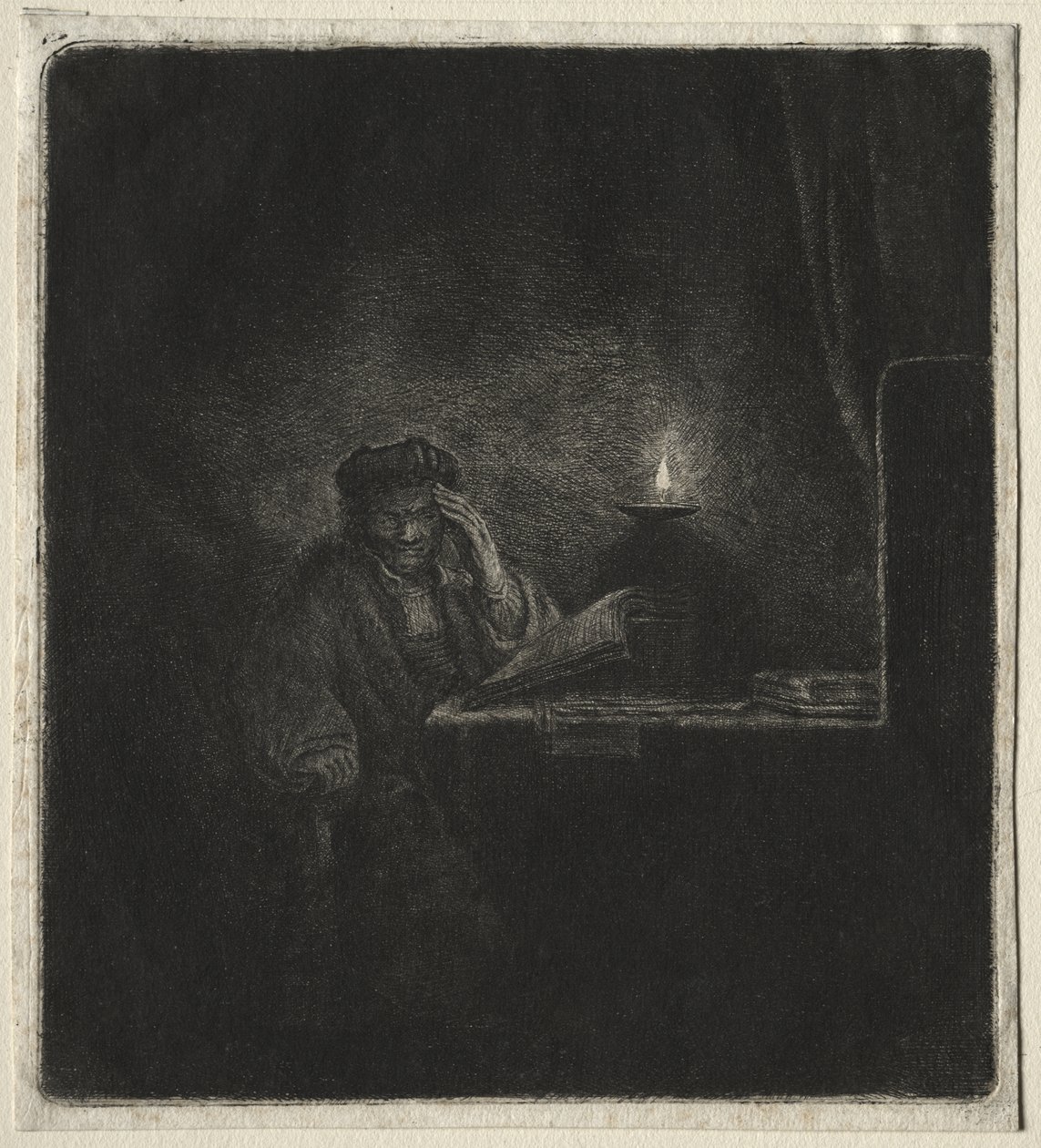 Kopio opiskelijasta pöydässä kynttilänvalossa tekijältä Rembrandt van Rijn